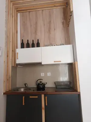 a kitchen with a sink and a counter with bottles at APARTMENT DELUXE MARINA CAPE 4 stars complex 33 6 in Aheloy