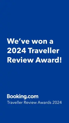 a blue sign that says weve won a traveler review award at APARTMENT STUDIO DELUXE MARINA CAPE 4 stars resort 33 5 in Aheloy