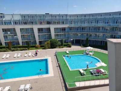 an overhead view of two swimming pools in a building at Gradina Sunny Deluxe apartment in Sozopol