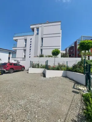 a building with a red car parked in front of it at SAPPHIRE in Sozopol