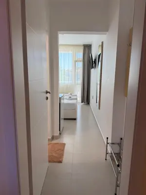 a hallway with a hallway leading to a room at Borko Guest House in Primorsko