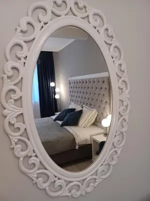 a white mirror with a bed in a bedroom at Tara Deluxe Apartment in Varna City