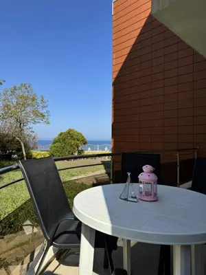 a table with a pink tea pot on top of it at Villa Rouge - Apartment Victoria in Sozopol