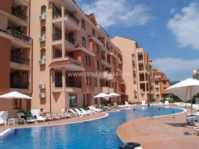 a swimming pool in front of a building at Holidays apartment Kassandra Sunny Beach in Sunny Beach