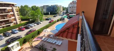 a balcony of a building with a view of a parking lot at Holidays apartment Kassandra Sunny Beach in Sunny Beach