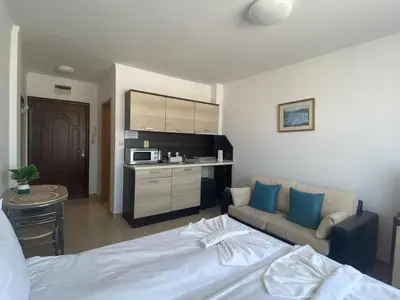 a hotel room with a bed and a couch at SUMMER BREEZE 503 Private Studio SUNNY BEACH in Sunny Beach