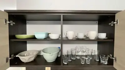 a shelf with glasses and bowls and other dishes at SUMMER BREEZE 503 Private Studio SUNNY BEACH in Sunny Beach
