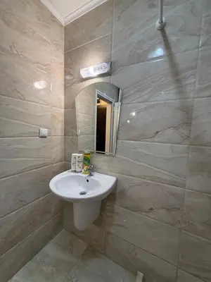 a bathroom with a sink and a mirror at Студио ''Сарафово'' на първа линия in Burgas City