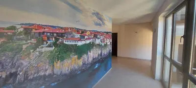 a mural on the wall of a room with a wall at Sozopoly studio in Sozopol