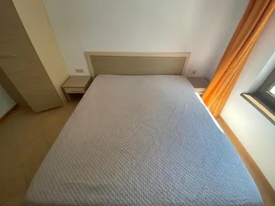 a bed in a small room with a window at ROYAL SUN O 31 Apartment Royal Sun in Sunny Beach
