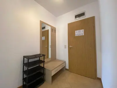 a room with a closet and a wooden door at ROYAL SUN O 31 Apartment Royal Sun in Sunny Beach