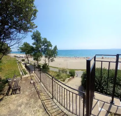 a view of the beach from the balcony of a beach at Апартамент Морски оазис in Burgas City
