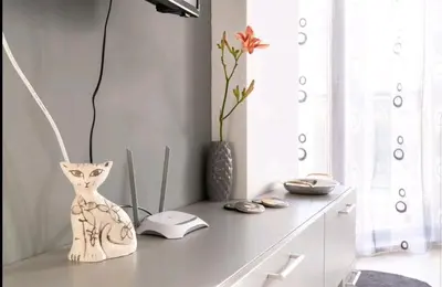a table with a vase on top of it at LOVE apartment in Burgas City