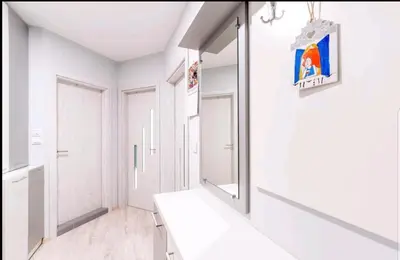 a white bathroom with a mirror and a sink at LOVE apartment in Burgas City