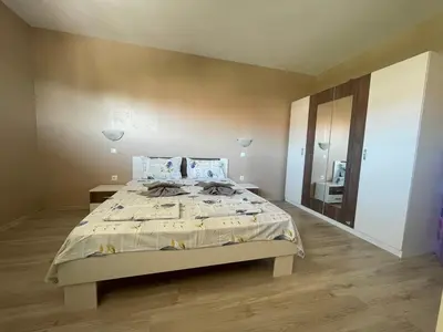 a bedroom with a large bed and a large mirror at Cozy 1BD Apartment with a Lovely Sea View by Flat Mаnаger in Sveti Vlas