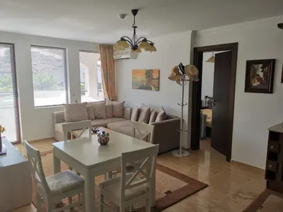 a living room with a couch and a table at Sveti Vlas Kambani Bells 3 Ap 7a in Sveti Vlas