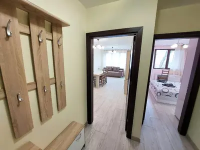a hallway with a door leading to a room at Апартаменти за гости Делукс in Burgas City