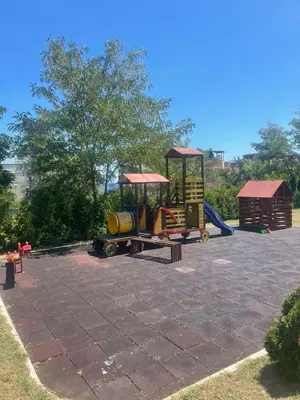 a playground with a train and a slide at Atlantik-Byala SP apartments in Byala