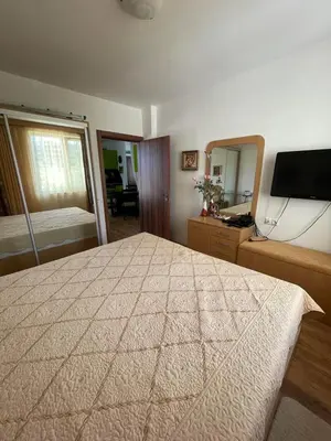 a bedroom with a large bed and a large mirror at Atlantik-Byala SP apartments in Byala