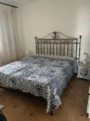 a bedroom with a bed with a quilt on it at Complex Monastery 1 -Marina Dinevi -Saint Vlas in Sveti Vlas