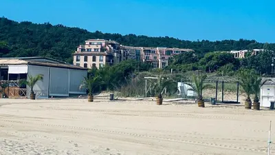 an empty beach with a building in the background at Свети Йоан in Sozopol