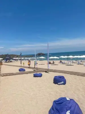 a group of blue frisbees in the sand on a beach at Perla Del Mar Studio PANORAMA First line in Lozenets