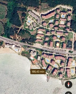 an overhead view of a beach with houses and the water at William's apartments - fourth pretty studio in Sveti Vlas