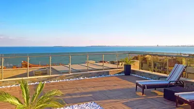 a patio with a view of the ocean on a building at Premium Apartment Villa Aristo in Sveti Vlas