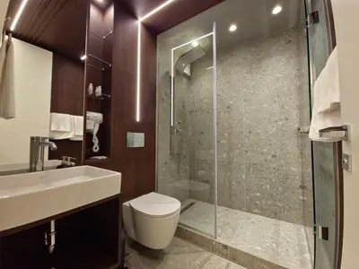 a bathroom with a toilet and a glass shower at Diamond Beach Sarafovo by KP - Luxury Collection, Apt 5 in Burgas City