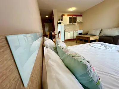 a bedroom with a bed and a living room at Privilege Fort Beach - Menada Apartments in Elenite