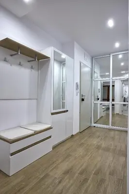 an empty room with white walls and wood floors at Weiss Estate by EstateAutomata in Burgas City