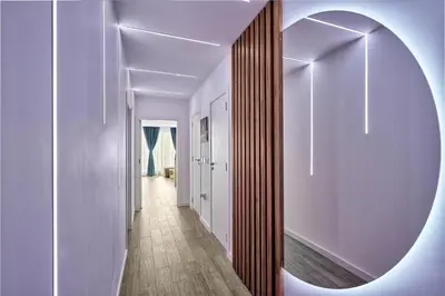 a hallway with a mirror on a wall at Miami Vibe by EstateAutomata in Burgas City