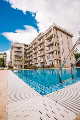 a swimming pool in front of a building at LifeStyle 6 in Sunny Beach