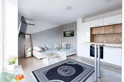 a living room with a couch and a table at LifeStyle 6 in Sunny Beach