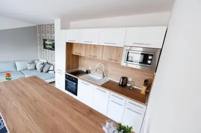 a kitchen with white cabinets and a counter top at LifeStyle 6 in Sunny Beach