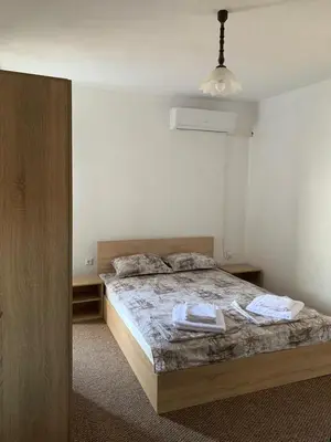 a bedroom with a bed in a room at Sozopol Old Town - Guest House Fenix in Sozopol