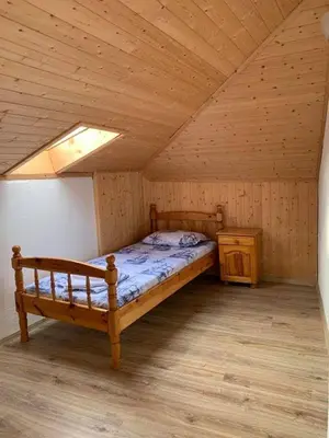 a bedroom with a bed and a wooden ceiling at Sozopol Old Town - Guest House Fenix in Sozopol