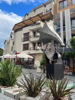 a statue in front of a building at Azzurro Premium Apartment on Bulevard Bogoridi in Burgas City