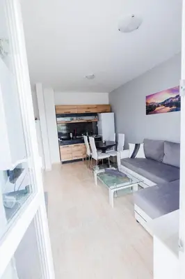 a living room with a couch and a table at LifeStyle 6 in Sunny Beach