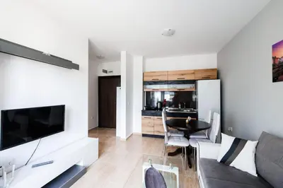 a living room with a couch and a table at LifeStyle 6 in Sunny Beach