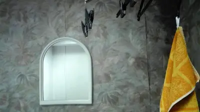 a mirror on a wall in a bathroom at Стаи на пъпа на Варна, входа на Морската градина in Varna City