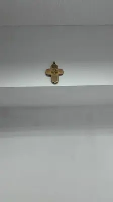 a cross on top of a white wall at Стаи на пъпа на Варна, входа на Морската градина in Varna City