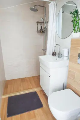 a bathroom with a sink and a toilet and a mirror at Shik & Chic in the Heart of Burgas # 5min from beach in Burgas City