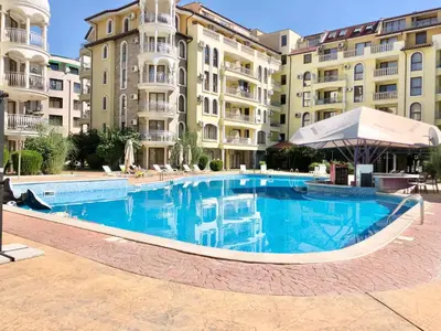 a large swimming pool in front of some buildings at Summer Dreams - Menada Apartments in Sunny Beach