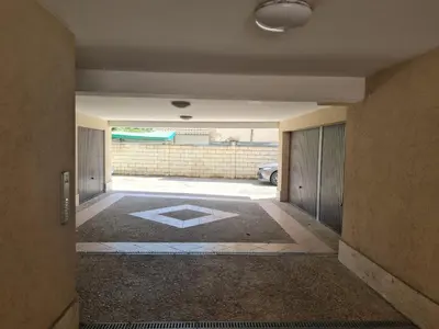 an empty hallway with a view of a garage at При Галя / Прекрасен апартамент в тих квартал in Varna City