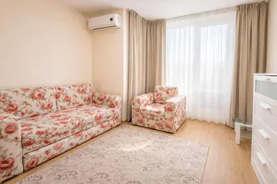 a living room with a couch and a chair at Nice family apartment in Sunny Beach