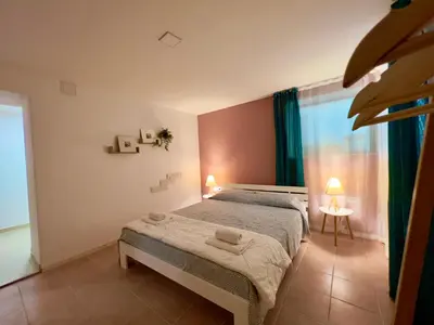 a bedroom with a bed and a window at Vi Del Mar Apartments Varna in Varna City