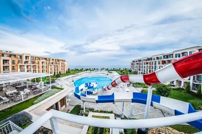 a water slide at a resort with a water park at Premier Fort Beach Resort in Sunny Beach