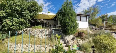 a house with a fence in front of it at Bungalow GHP-B in Varna City
