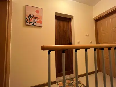 a stairway with a wooden door and a stair railing at Camping Gradina Garden Beach b33 in Chernomorets